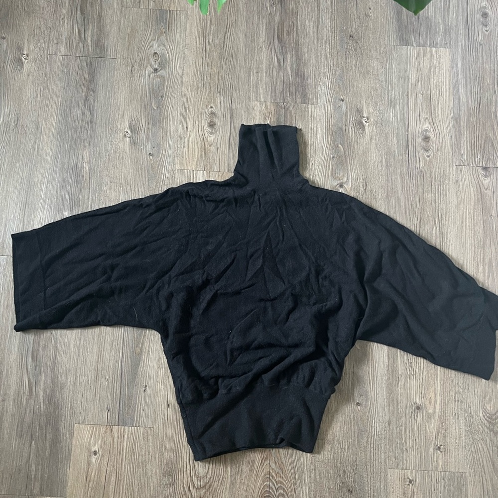 Loose black turtleneck sweater